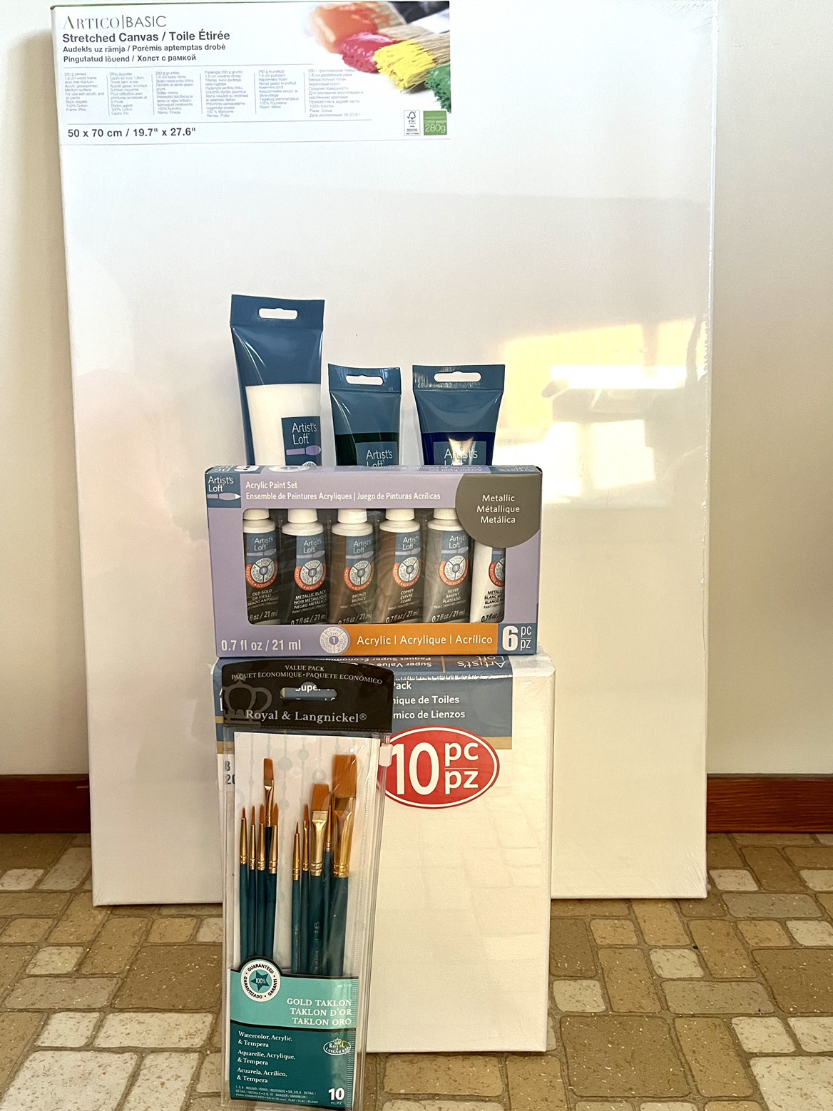 New art supplies, unused canvases, acrylic paint and brushes