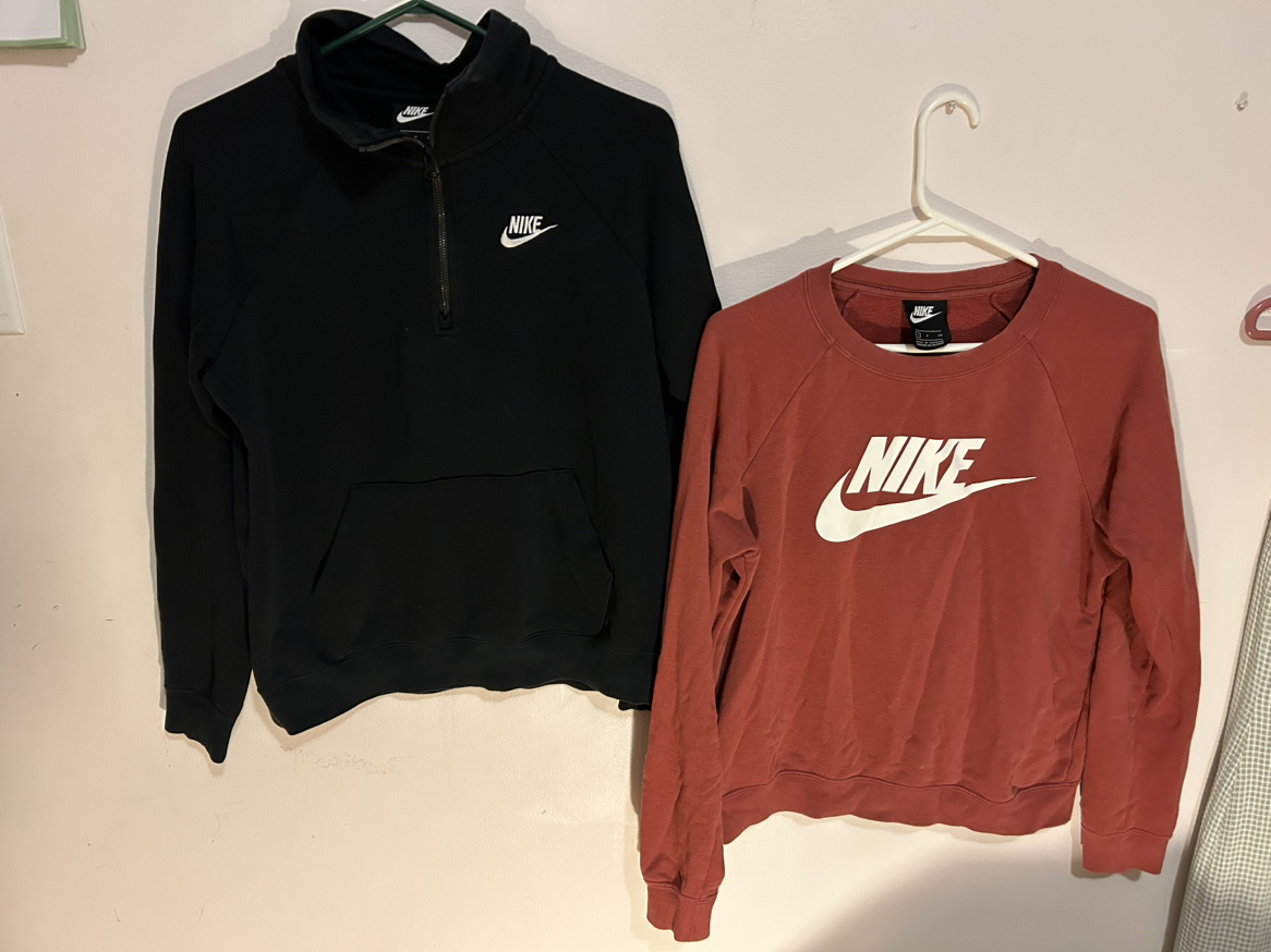 Two Nike sweaters one black one red. thumbnail