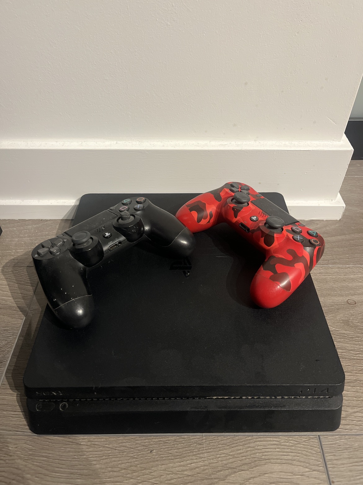 PS4 with controllers thumbnail