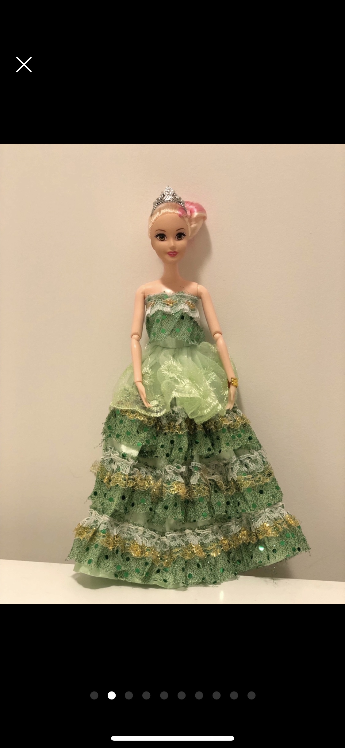 Barbie doll along with 9 exquisite Barbie dresses image indicator(2)