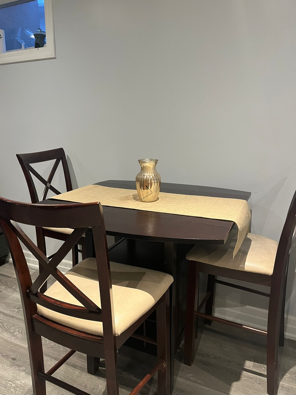 Dining table and chairs with wine rack.