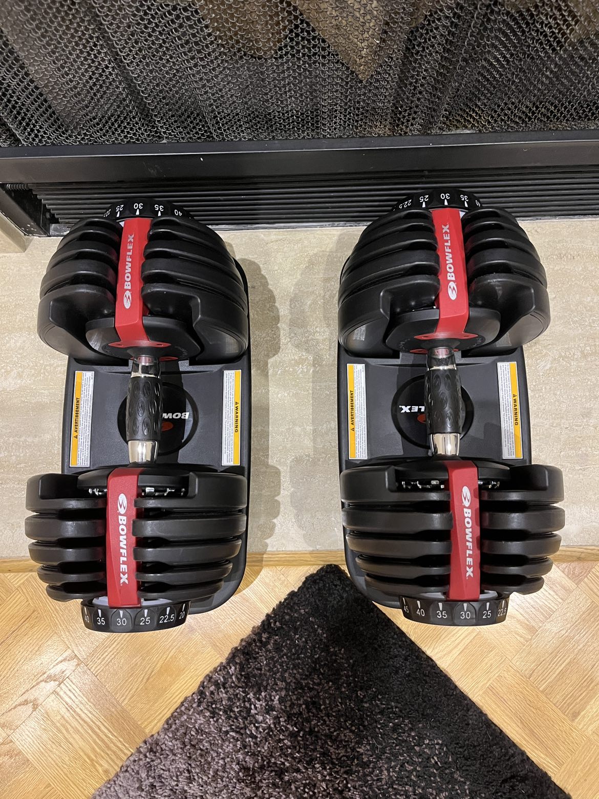 Adjustable dumbbells bowflex