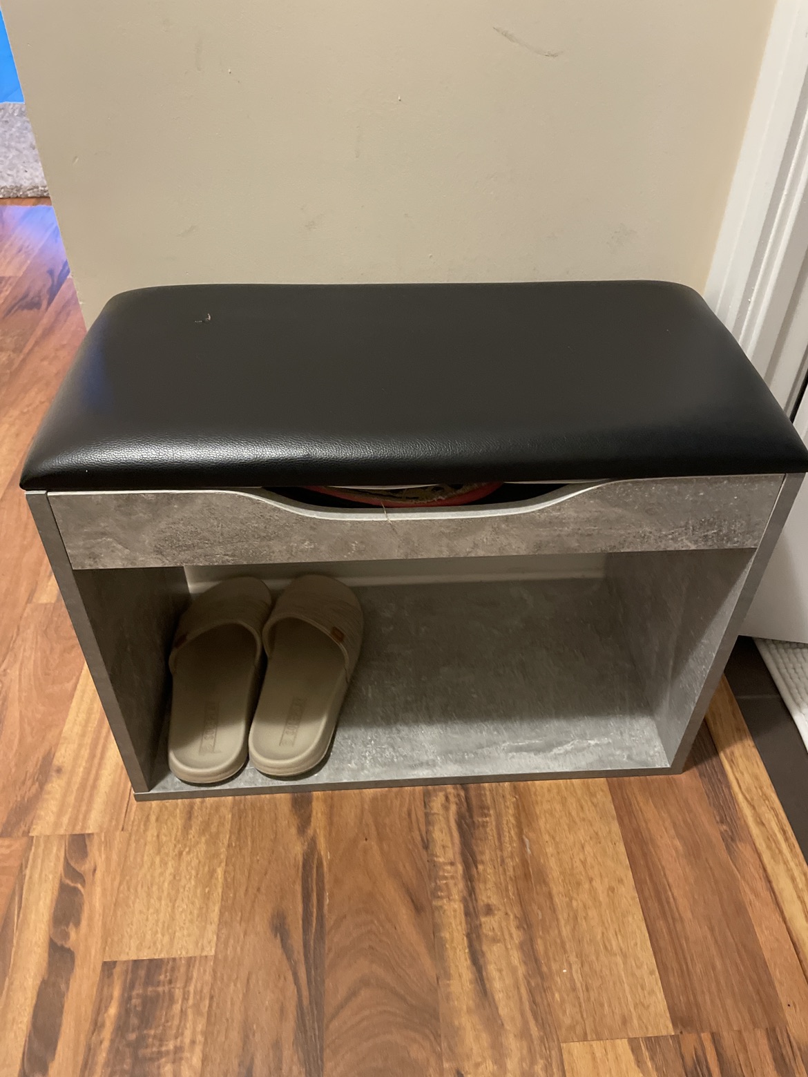 Shoe rack with seat cushion on top