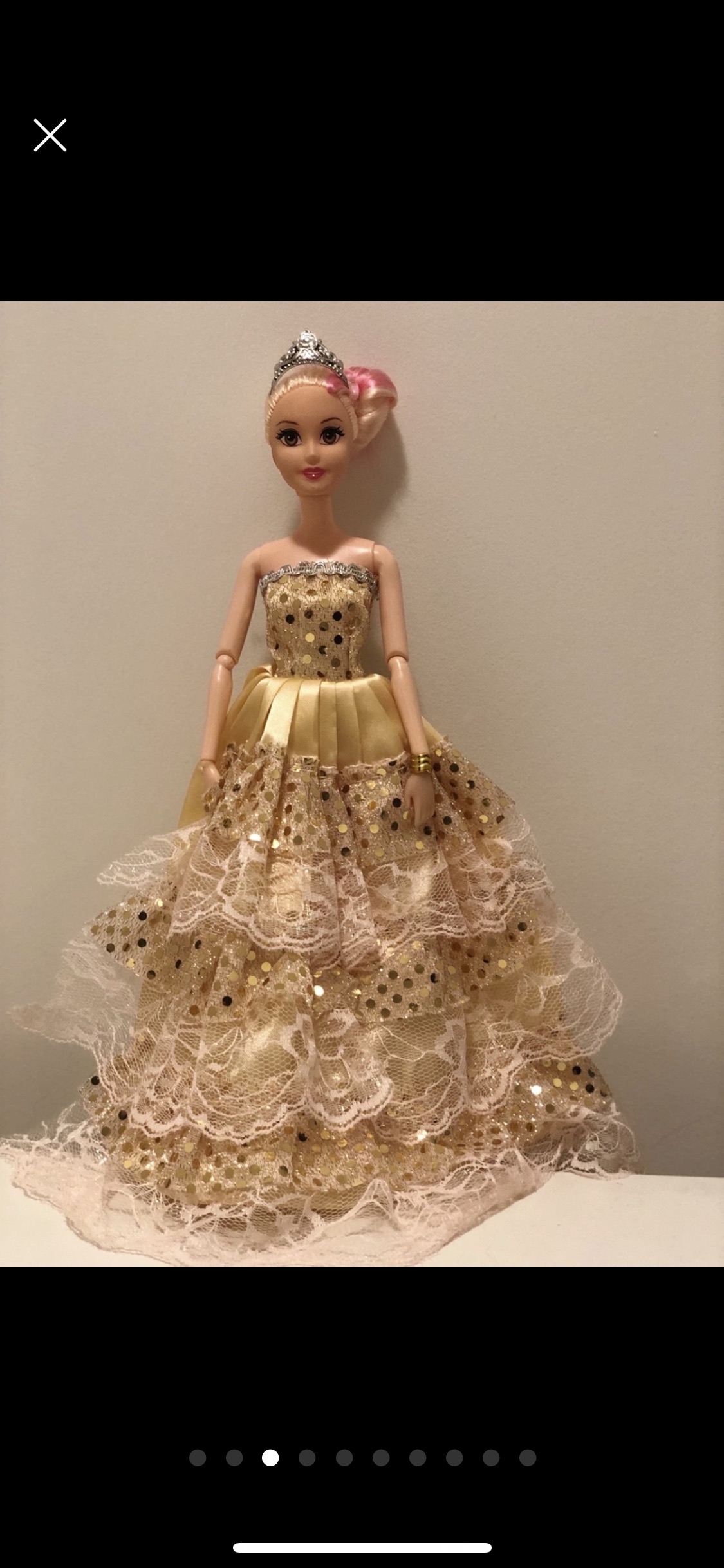 Barbie doll along with 9 exquisite Barbie dresses image indicator(3)