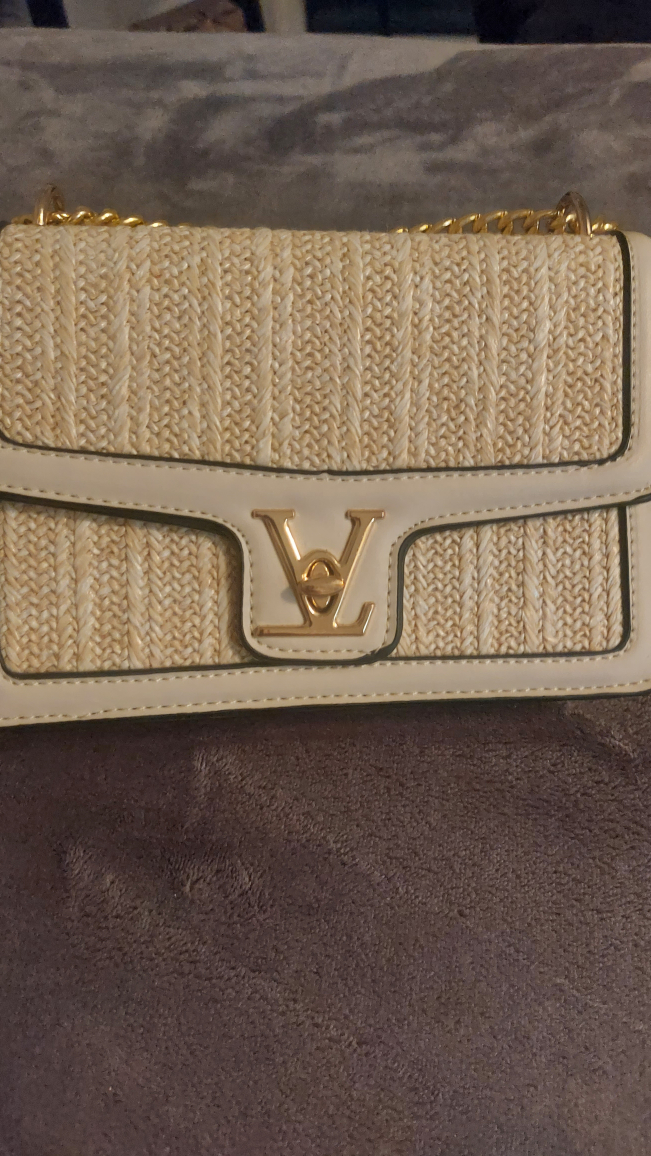 Fashionable cream and gold accent handbag
