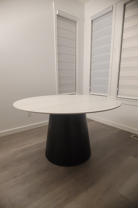 CONTEMPORARY CEREMIC DINING TABLE WITH BLACK WOOD GRAIN BASE