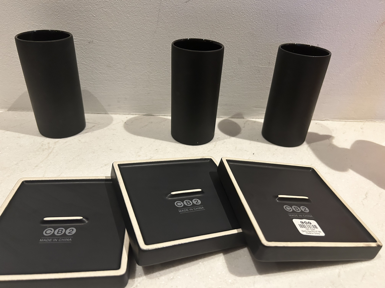 Cb2 black grouping. 3 side plates. 3 glasses. image indicator(6)