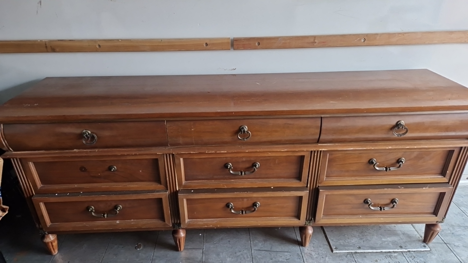 a large wooden chest of drawers