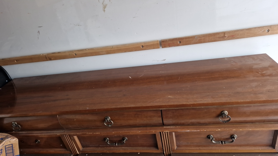 a large wooden chest of drawers - photo 2