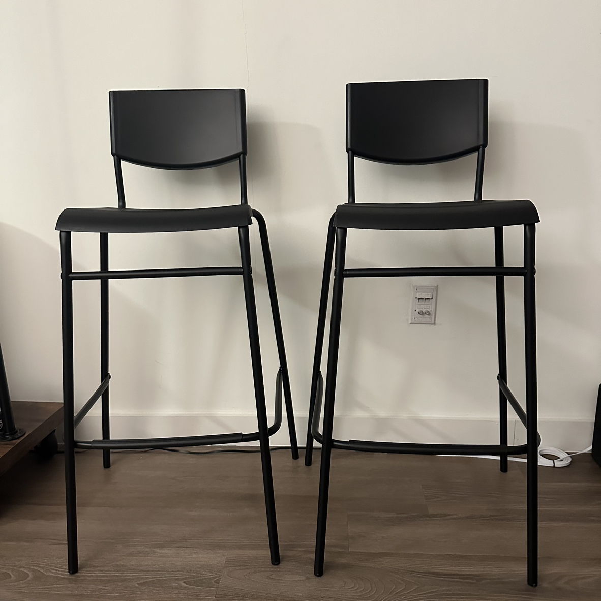 two ikea black stools