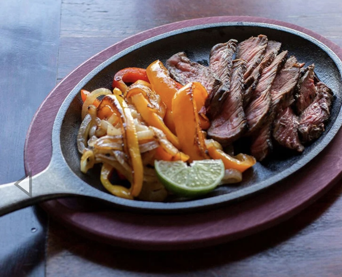 Lodge cast iron fajita pan and wooden serving tray image indicator(2)