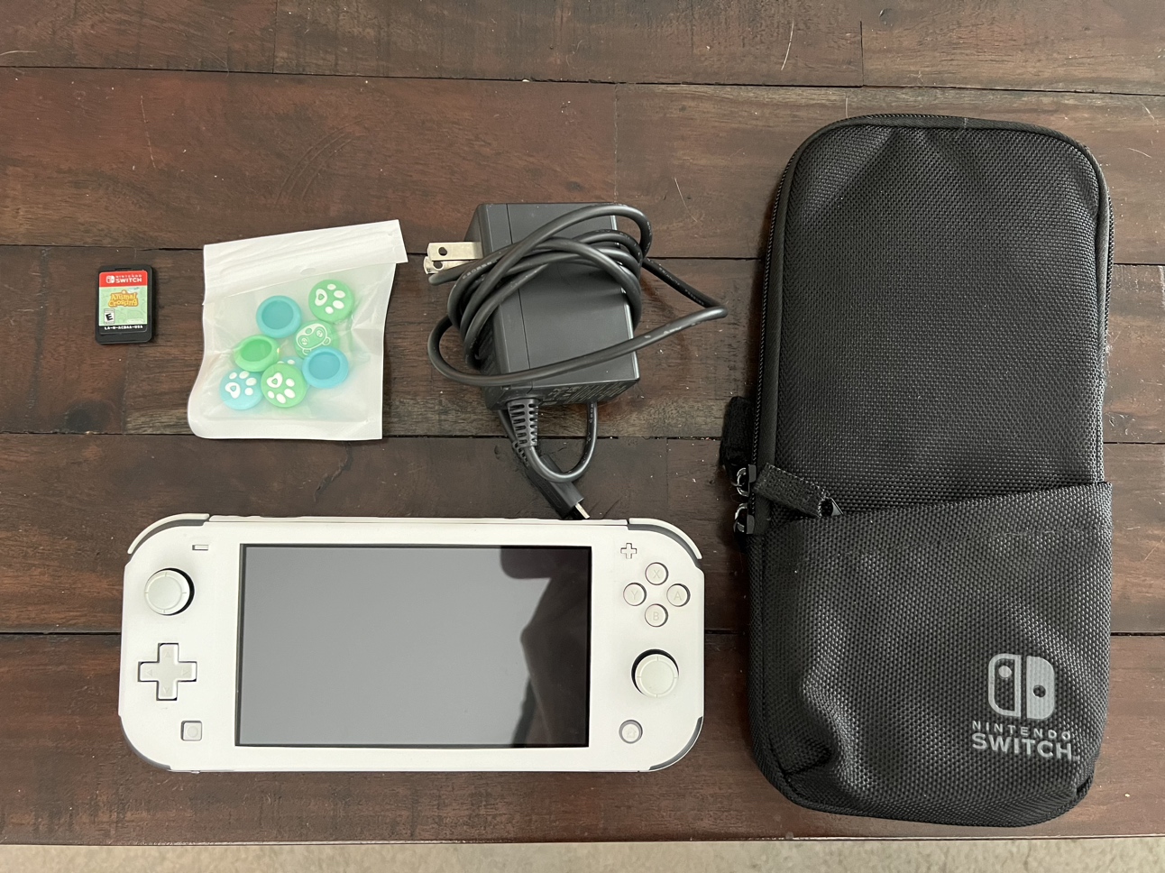 Nintendo Switch Lite (original grey colour / has white cover on)