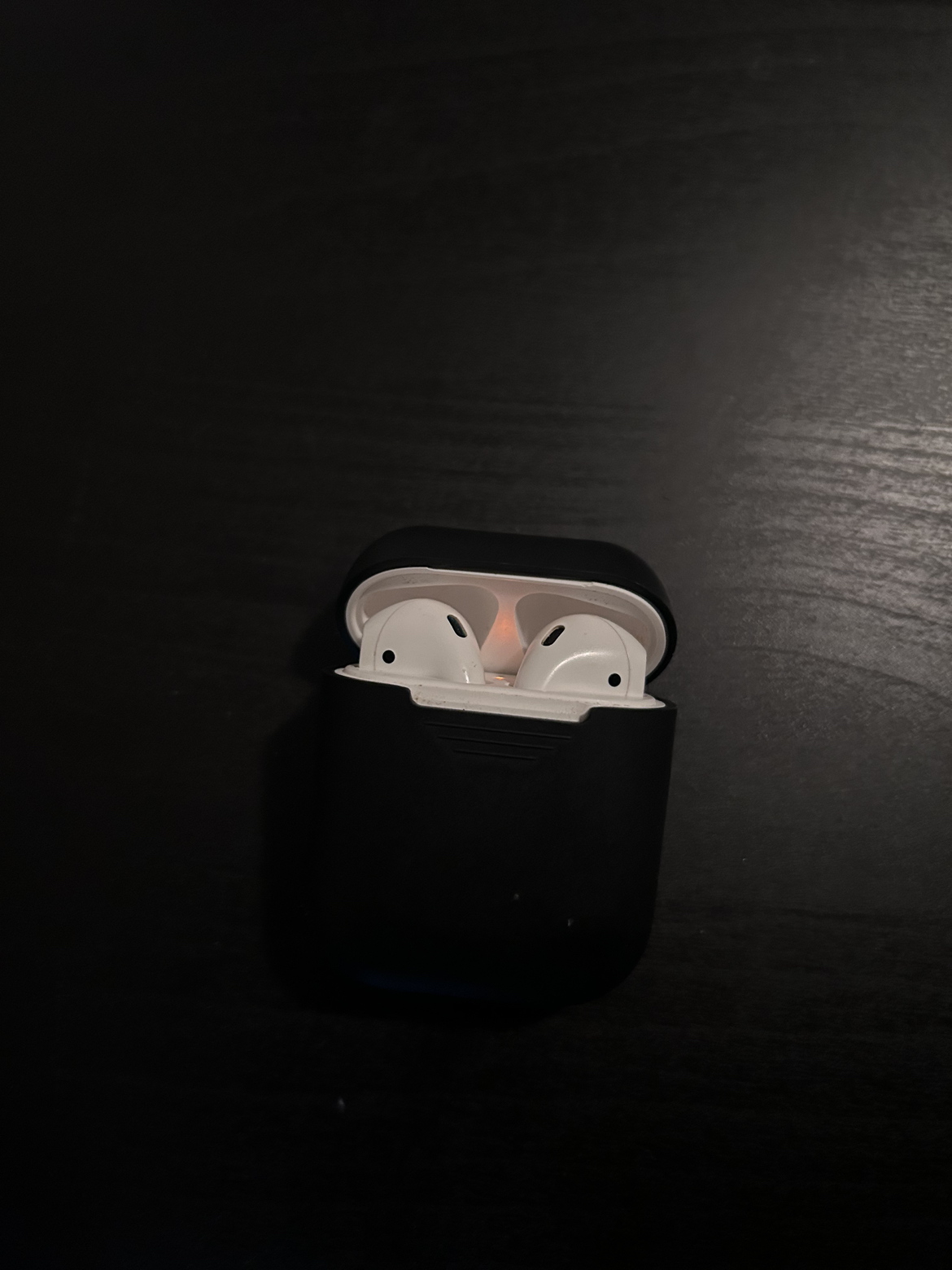 first generation genuine apple airpods (and 4 silicone cases)