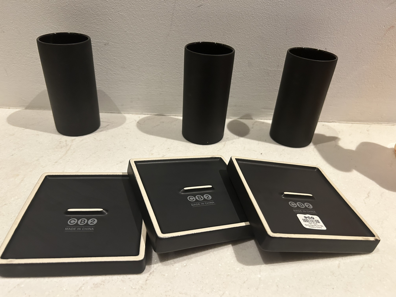 Cb2 black grouping. 3 side plates. 3 glasses. image indicator(7)