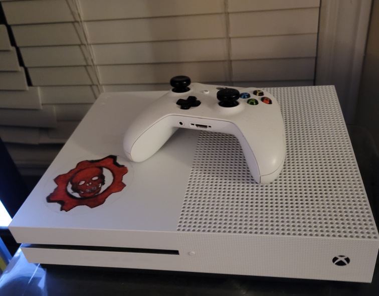 Xbox One S, with controller and games