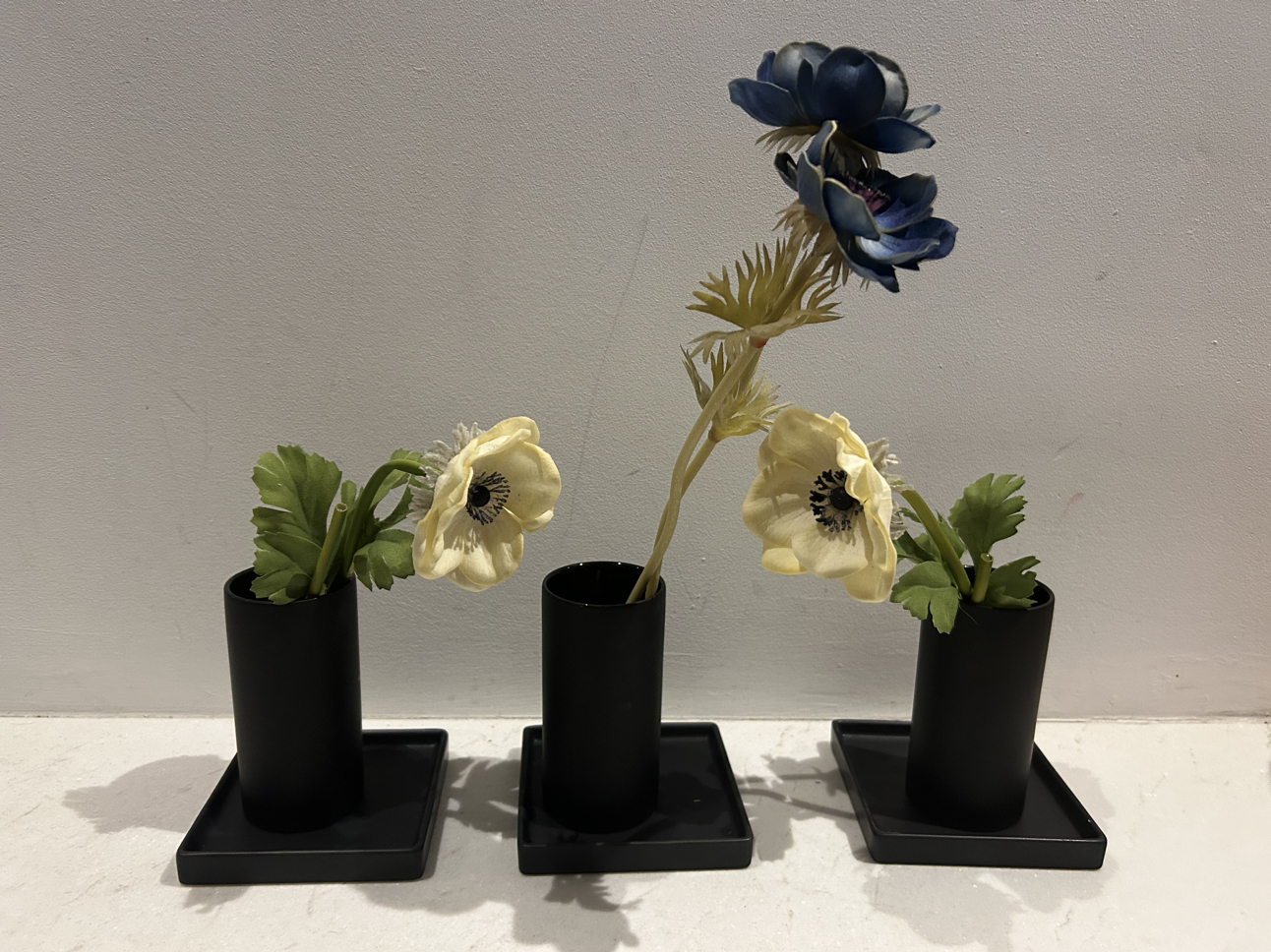 Cb2 black grouping. 3 side plates. 3 glasses. image indicator(2)