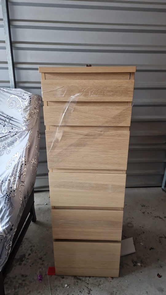 high wooden cabinet with a mirror