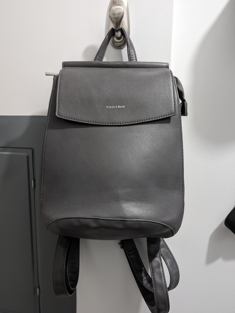 Grey backpack that converts to a side bag thumbnail