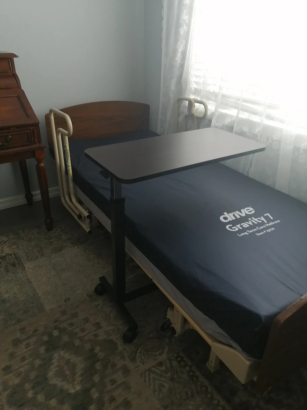 Homecare bed with mattress and side table