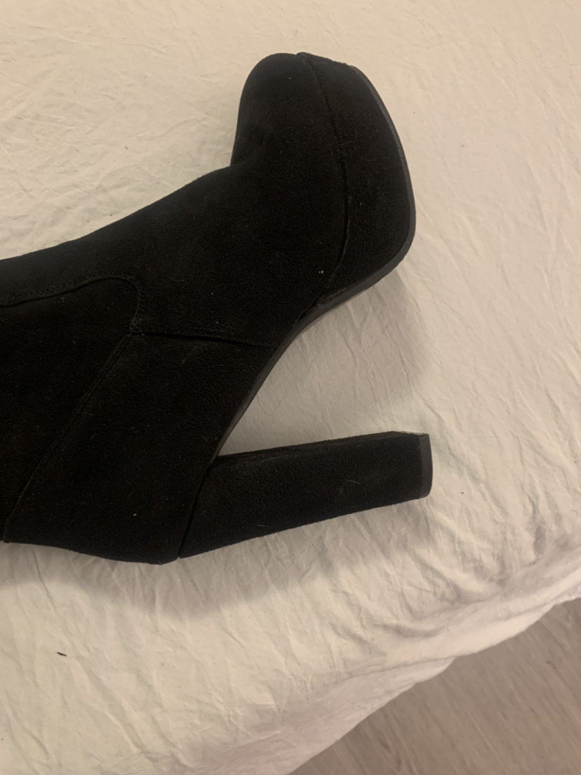 Black thigh high suede boots with lace up detail