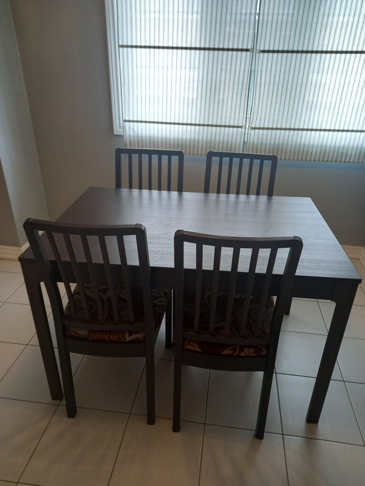 ikea extendable wooden table with four chairs