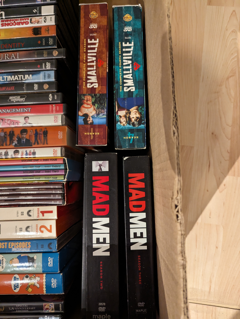 Box of Assorted DVDs - photo 4