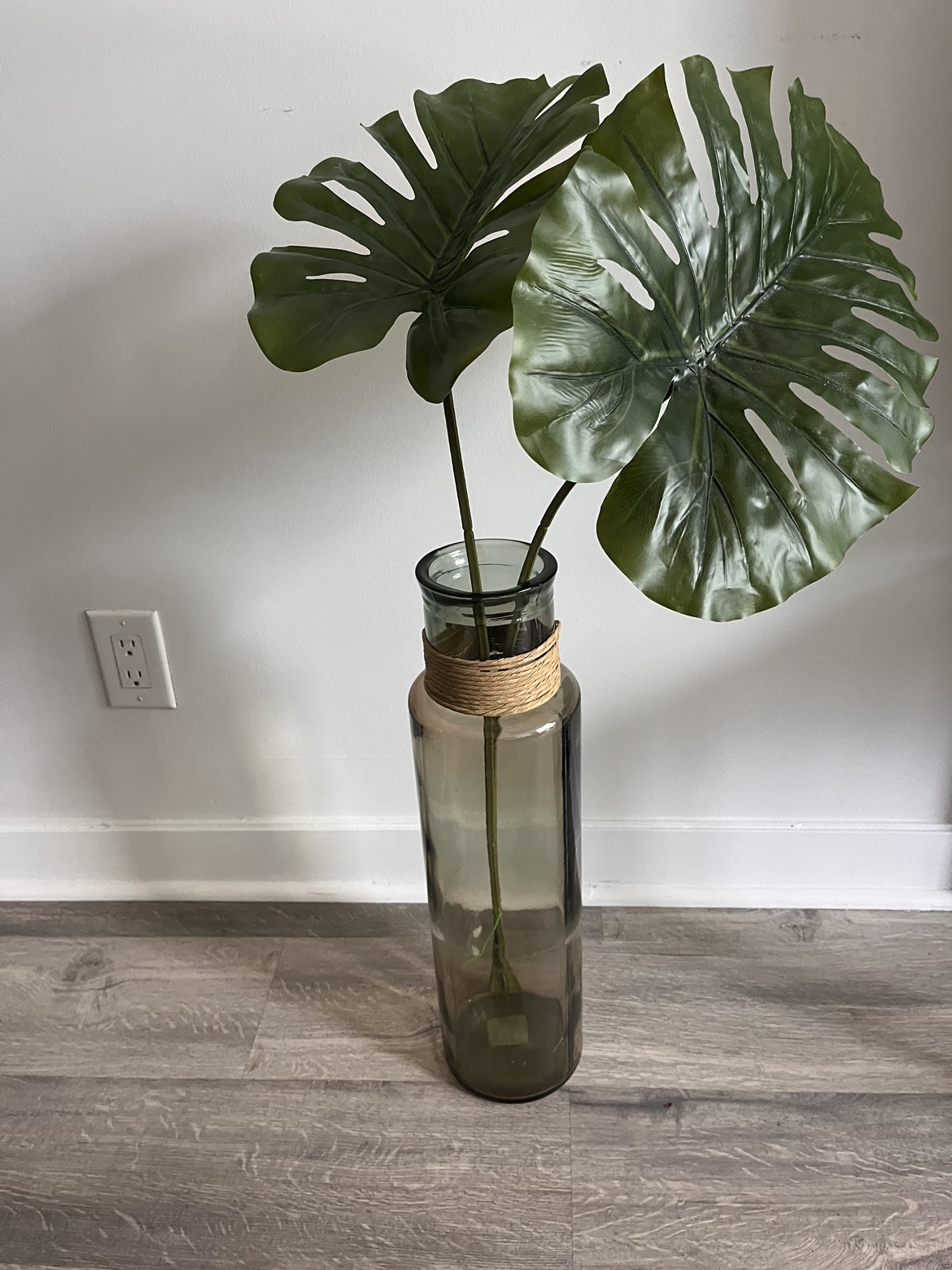 🏈 Tinted glass vase with artificial greenery thumbnail