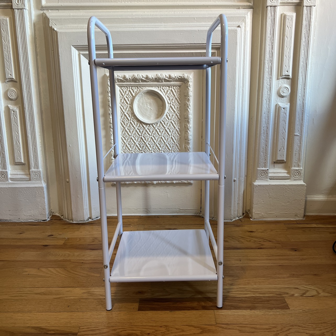 White metal shelf unit