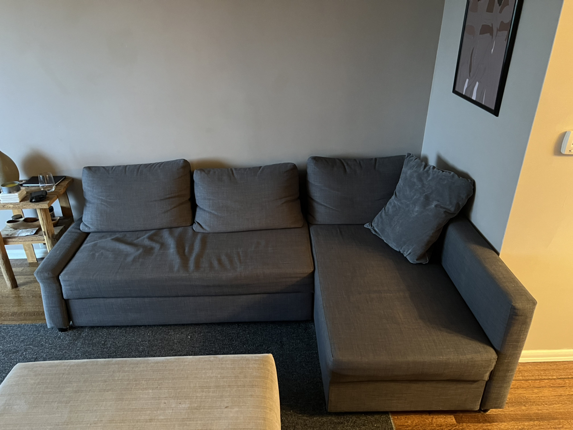 Sectional couch with pull out bed and storage