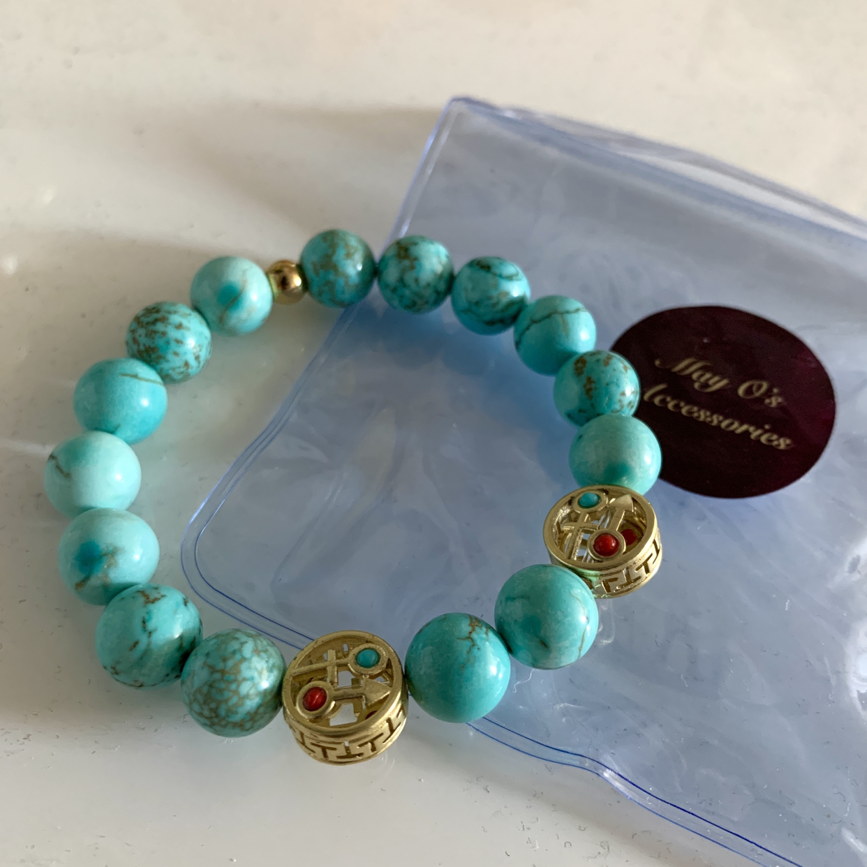 Turquoise bracelet with charm