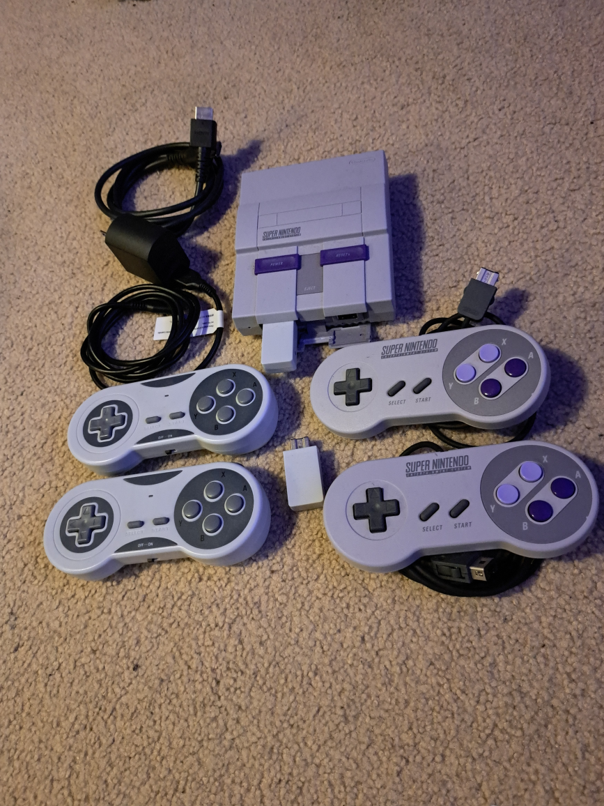mini SNES + over 100 preloaded games  + 2 wireless controllers