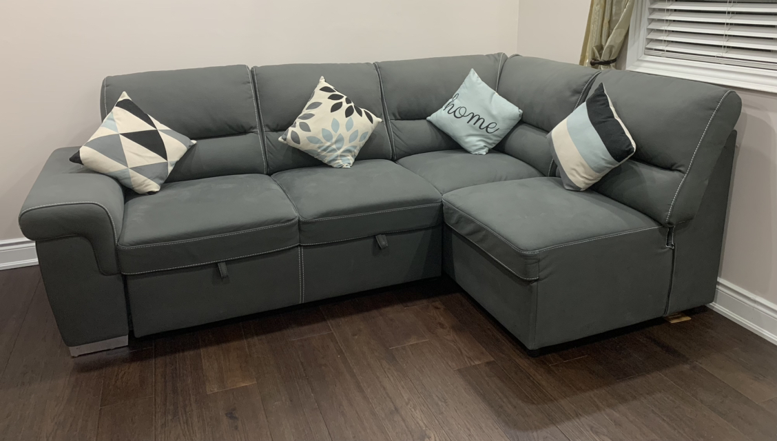 Sectional sofa with pop up bed
