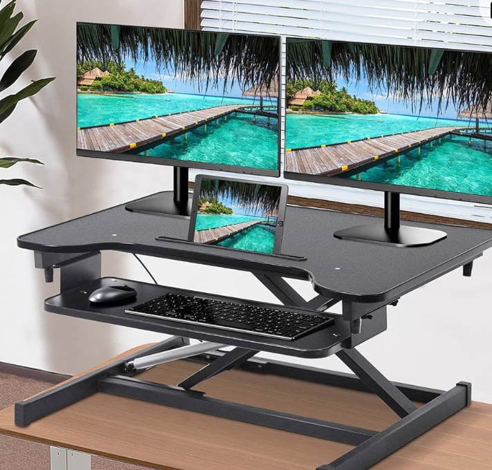 Adjustable standing desk converter