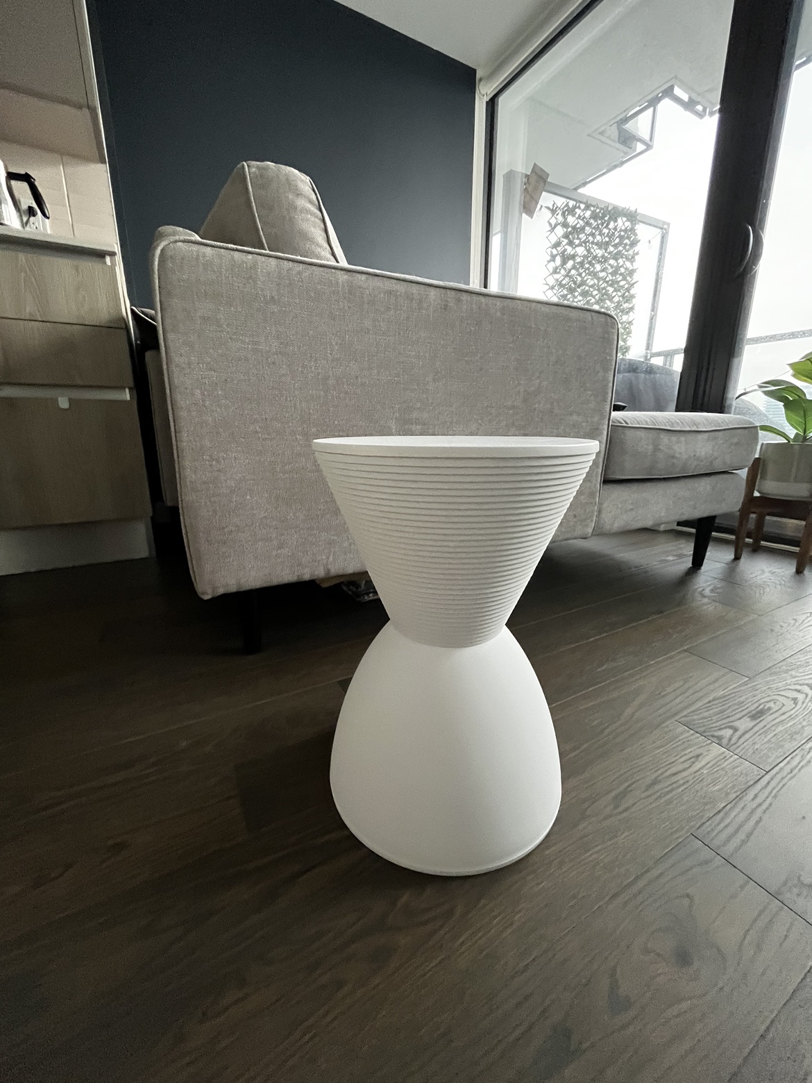 White hourglass side table with storage
