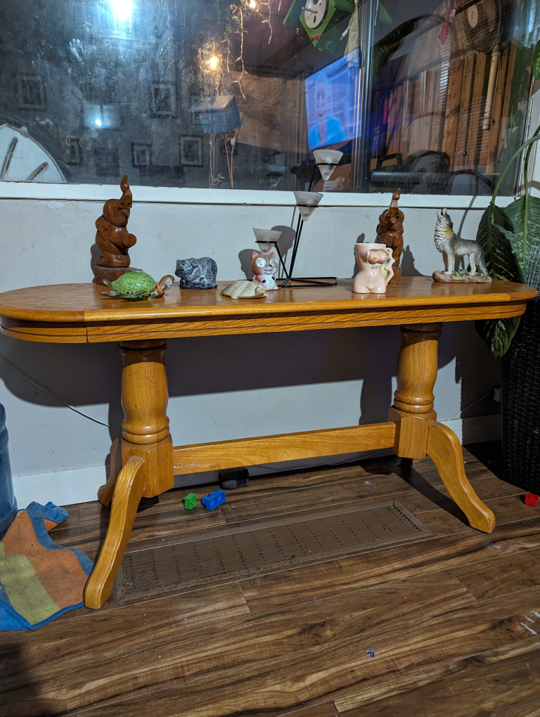Solid oak entry table 52 inches long 16 inches wide  24 inches h