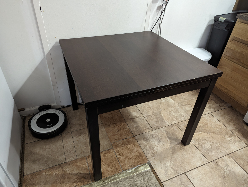 IKEA dark wood extendable dining table