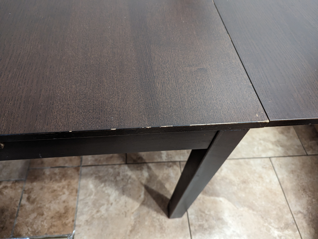 IKEA dark wood extendable dining table - photo 3
