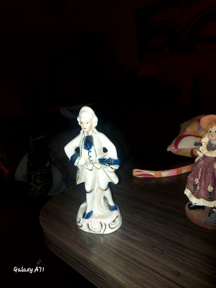 Blue And White Porcelain Colonial Figurine.
