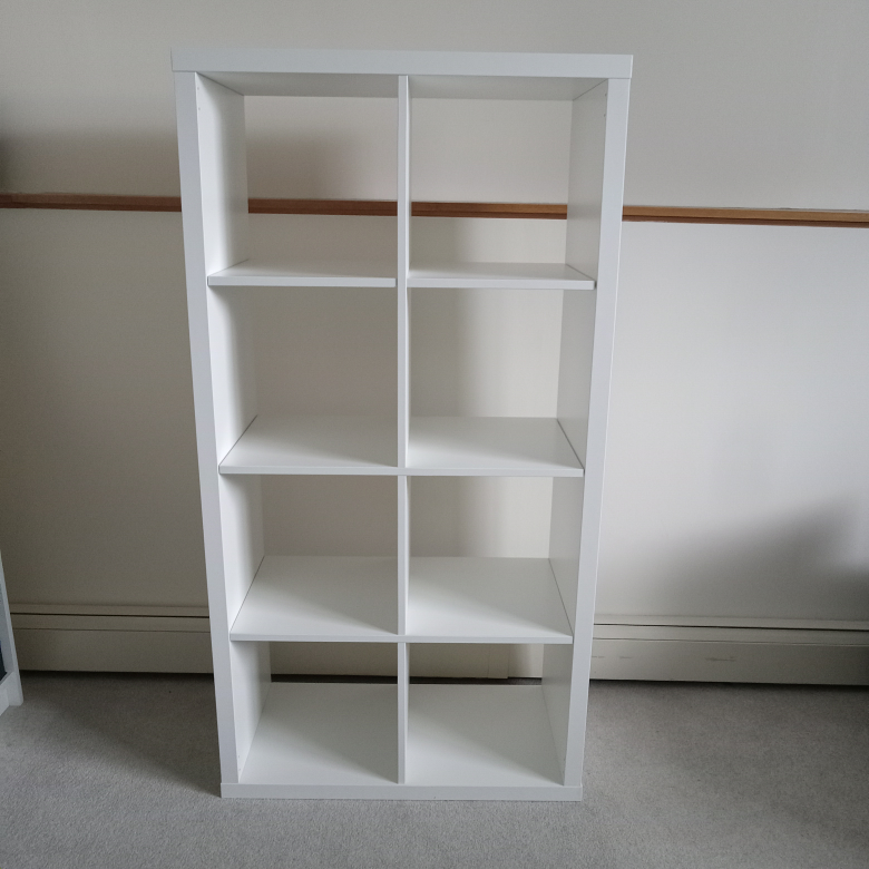 ikea shelf with 4 boxes