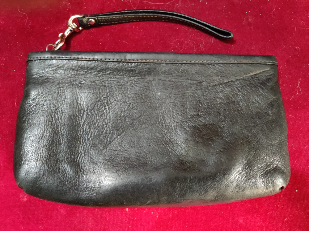 Coach wristlet, black leather exterior. image indicator(4)