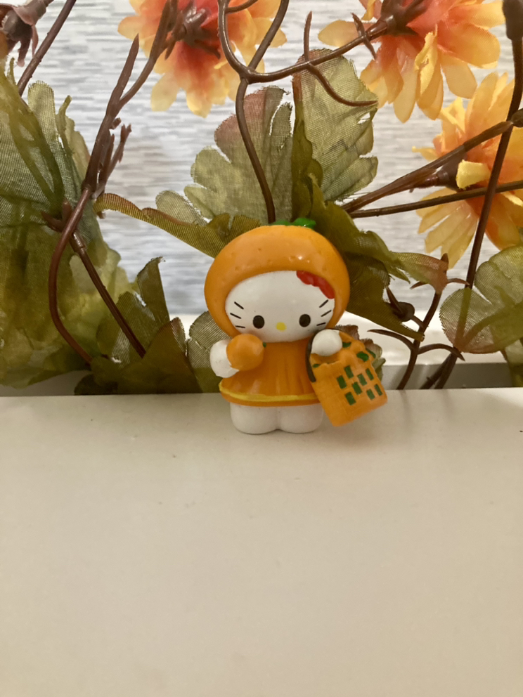 collectible orange hello kitty figure thumbnail