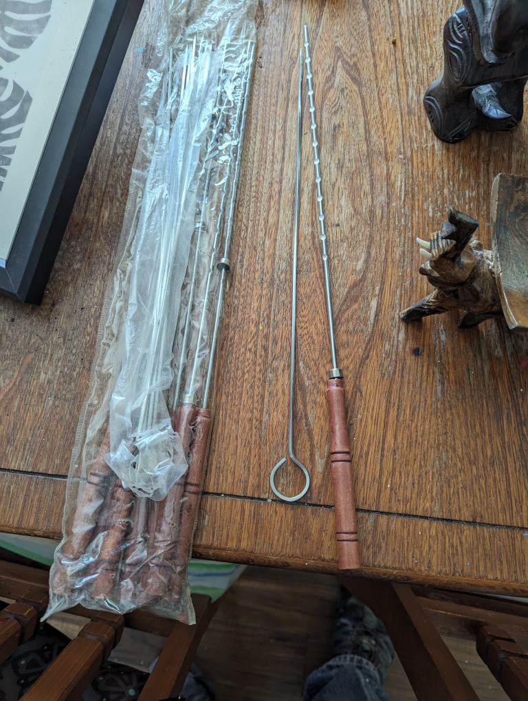 14 cabob sticks 8 with wooden handles and 6 metal $10 for all