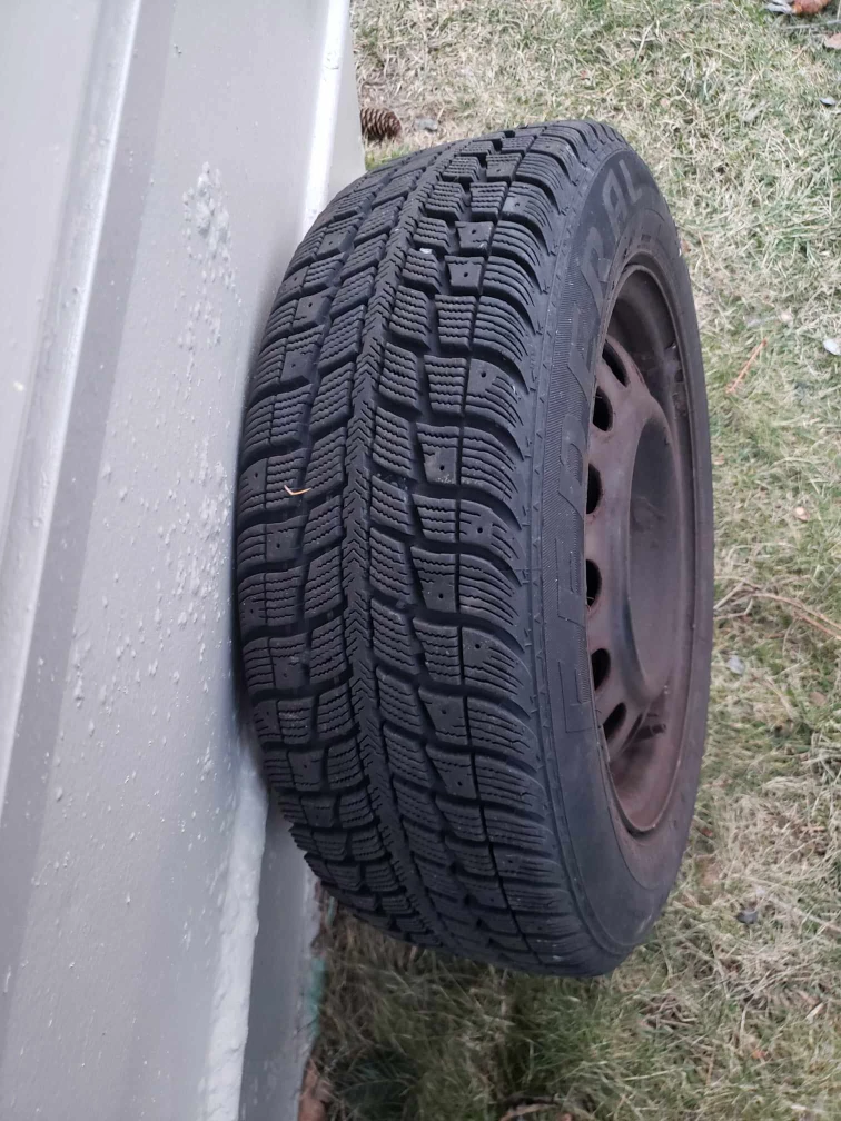 4 used snow tires with rims.