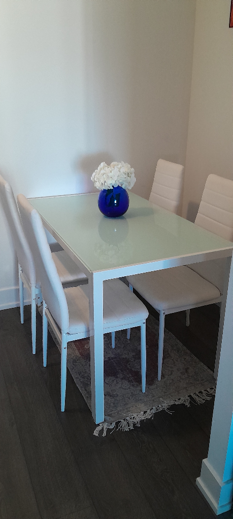 Beautiful tempered glass dining table and 4 chairs.