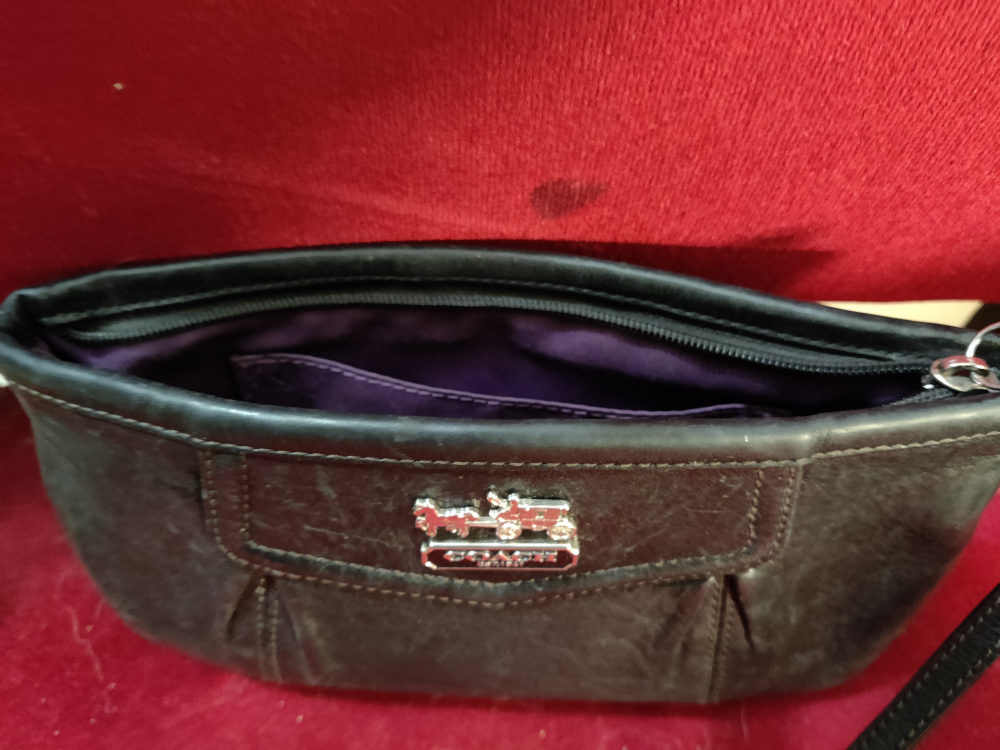 Coach wristlet, black leather exterior. image indicator(2)