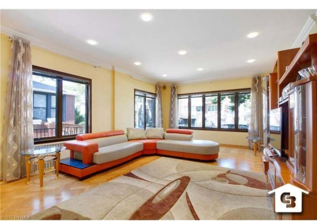 orange and off white modern leatherette sectional ( x3) sofa.