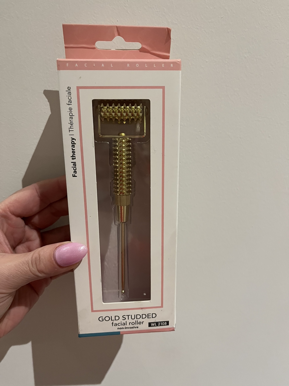 Gold studded facial roller image indicator(2)