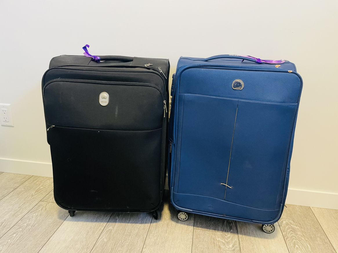 Two used checking Luggage