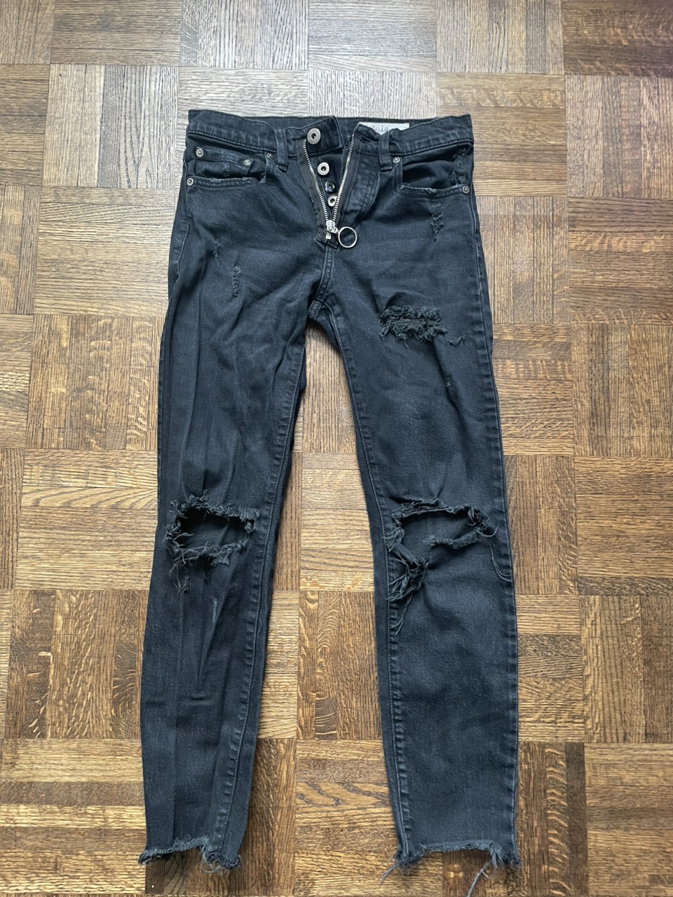 Black button up ripped jeans