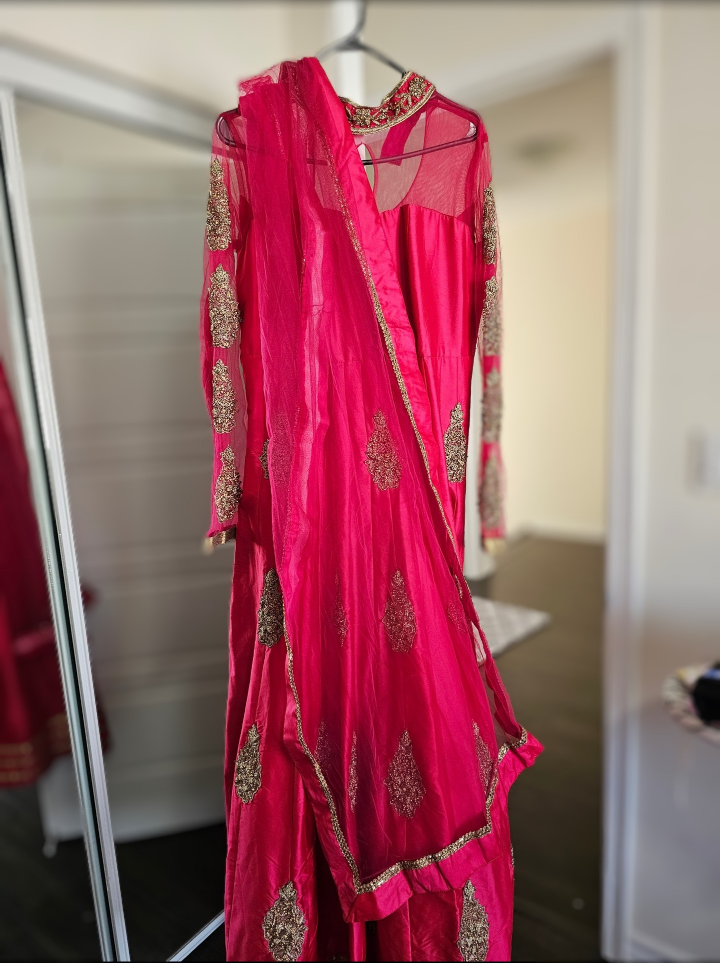 Pink designer suit - very rarely used